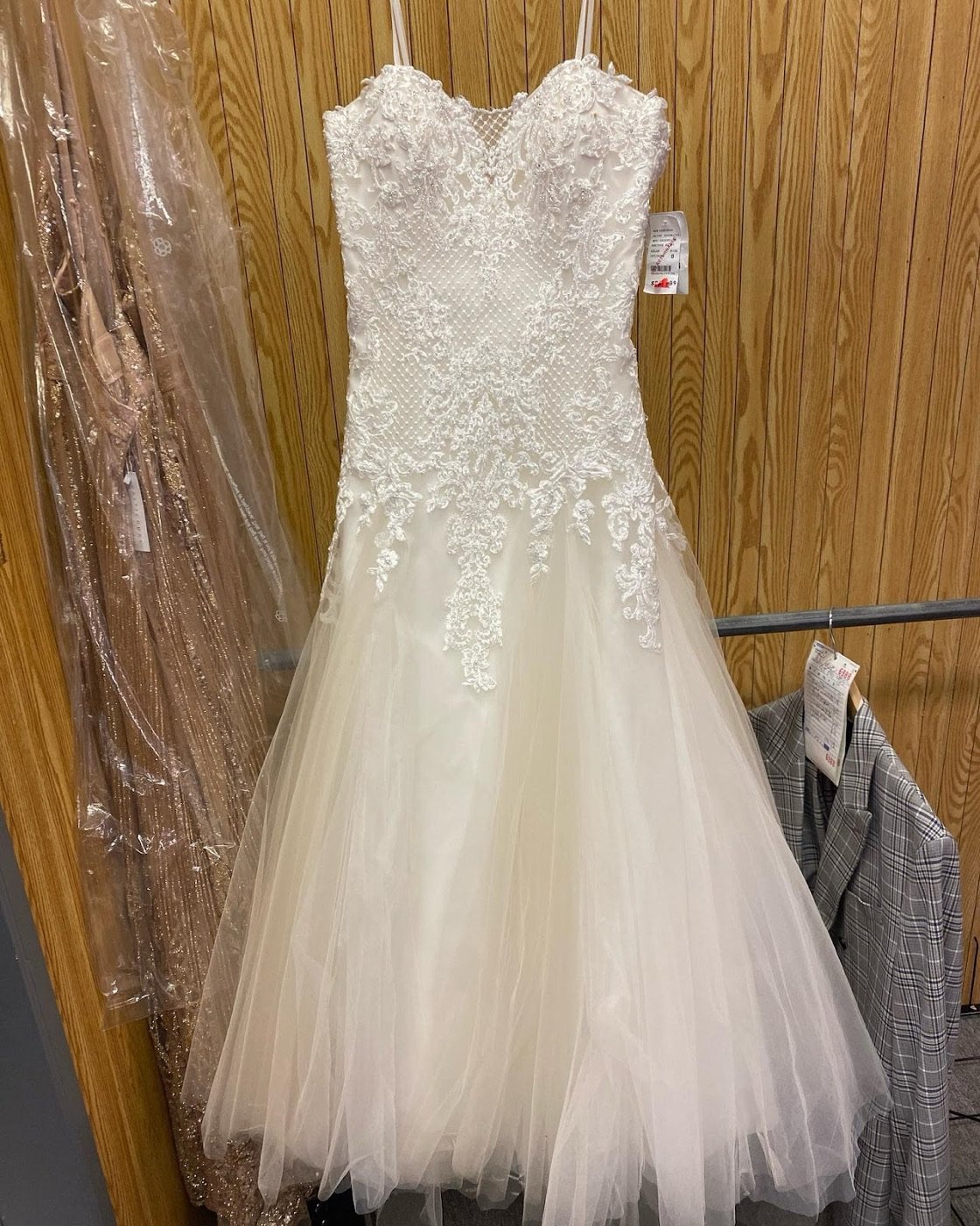 A lace bridal gown in for alterations
